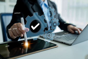 A businessman engages with a digital tablet, showcasing modern technology and automation concepts. The bright office setting highlights professionalism and innovation. Gantry