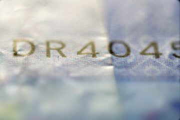 Close-up View of a Worn-out Paper Currency with Unique Serial Number