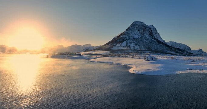 Lofoten islands beautiful scandinavian landscape of nordic sea with coastal of yellow houses in fishing village Sakrisoy, Reine, Norway