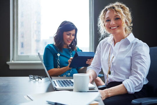 Portrait, business woman and laptop in meeting for legal research, trial preparation and filing. Attorney, female paralegal and happy with tech at law firm for case management and drafting contract