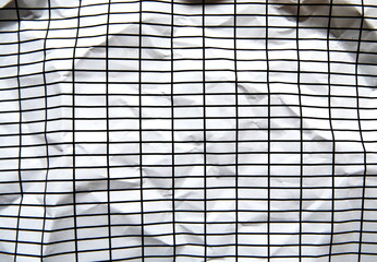 しわくちゃの罫線模様の入った紙