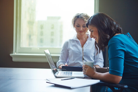 Coffee, woman and meeting with laptop in office for trial preparation, contract review or email. People, legal assistant and happy with beverage at law firm for proofreading case evidence or research