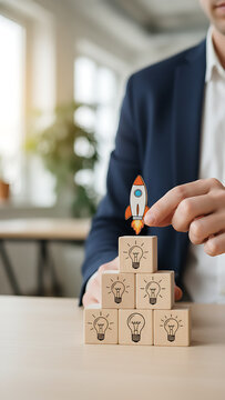 Idea creation and innovative product launching concept. Wooden block with rocket and idea generation icons. Idea creation, innovation and the launch of a new product from concept, Business Innovation