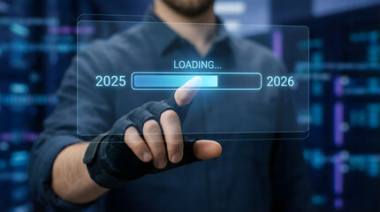 Futuristic,businessman,hand,wearing,technical,gloves,touching,a,digital,loading,progress,bar,transitioning,from,the,year,2025,to,2026,representing,the,fast,evolution,of,modern,technology.