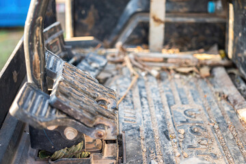 Close-up at gas pedal or throttle foot step of backhoe excavator vehicle. Industrial vehicle object...