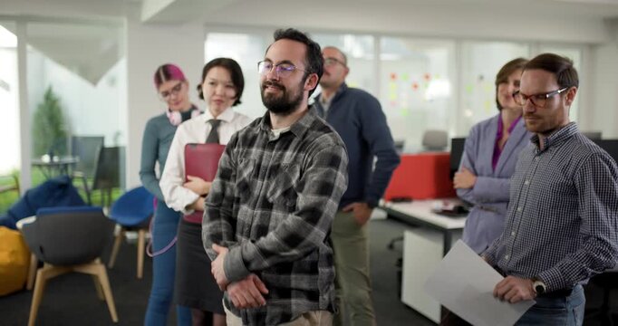 Team meeting in modern office with business professionals discussing projects during work hours and sharing ideas in a collaborative environment