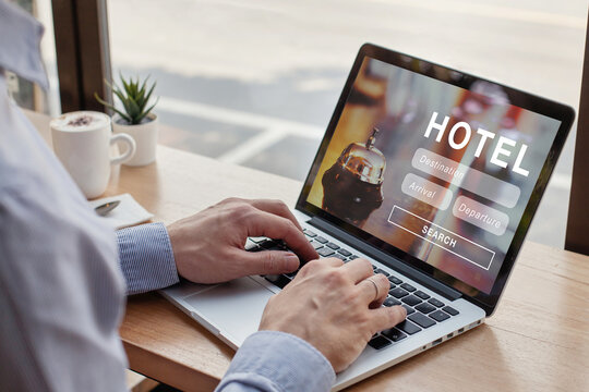 booking hotel online, travel planning website, internet reservation concept, man looking at screen of computer searching accommodation for tourism