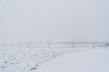 Winter view of a bridge crossing the Zeya River in Blagoveshchensk, Russia.