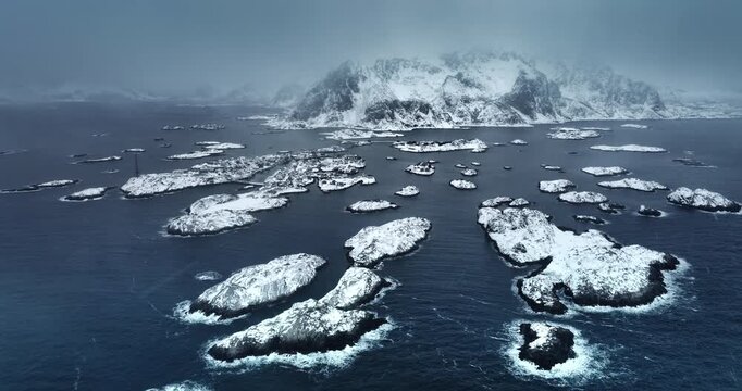 Panorama winter landscape of nordic fjords Lofoten Islands, Norway, seascape and Henningsvaer stadion covered in snow