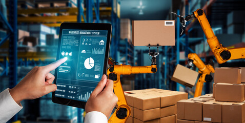 Smart robot arm systems for innovative warehouse and factory digital technology . Automation manufacturing robot controlled by industry engineering using IOT software connected to internet network .
