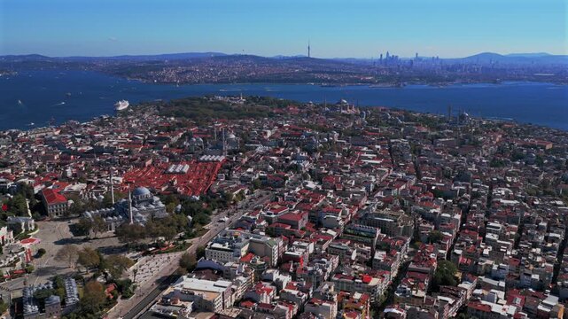 Morning Istanbul Turkey T&uuml;rkiye aerial drone sunny blue clear skies autumn bridge Blue Mosque synagogue temple cityscape skyscrapers Fatih Yenikapı Port Bosphorus Strait Harbor view forwards upwards