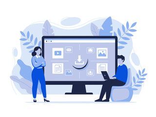 Two people working on a computer with a large screen displaying various software icons