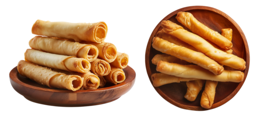 Fried cheese sticks wrapped in dough or spring rolls stacked in pile, isolated on white background, concept of Venezuela snack