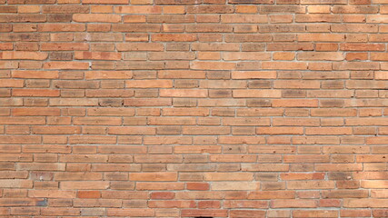 Old red brick wall. Rustic weathered antique red brick wall texture for a vintage background with copy space with selective focus.