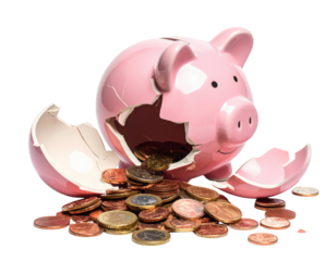 A broken pink piggy bank with coins spilling out.