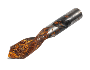 A close-up of a rusty drill bit showcasing intricate patterns and textures on its surface.