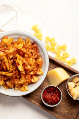 Crunchy fried pasta chips with dips.