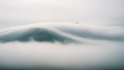 Cinematic fog landscape with mysterious unseen massive structure emerging subtly through mist, abstract atmospheric wide long shot, minimal calm mood, conceptual background for film and design