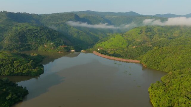 Aerial View Of El Carrizo Reservoir Surrounded By Lush Green Hills And Forested Valley In Jalisco, Mexico.
