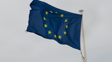 European Union Flag Waving in Strong Coastal Wind