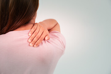 woman holding back while and suffer from unbearable pain health and problems, chronic back pain, backache in office syndrome, scoliosis, herniated disc, muscle inflammation