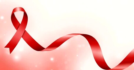 A flowing red ribbon for aids awareness and support on a sparkling background