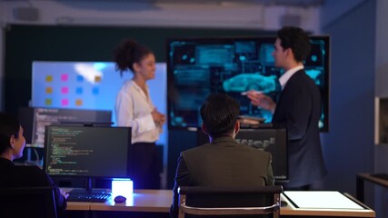Corporate technology meeting in a modern office at night. Professional team discussing automotive engineering strategy and market data displayed on monitoring screens. Staff using tablets and document - Powered by Adobe