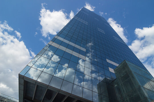 Glass mirrored South Tower (Tour du Midi or Zuidertoren), the tallest bulding in the country and once a tallest skyscraper in Europe, taken from the bottom under wide angle. Brussels, Belgium