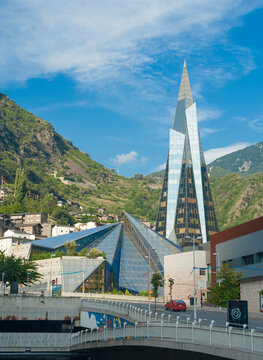 The building and glass pyramid of Caldea thermal spa resort among wooden mountains. Escaldes-Engordany, Andorra