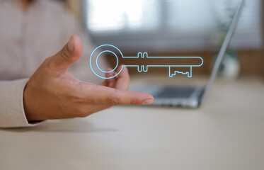 Human hand holding a glowing digital key symbolizing access and opportunity 
