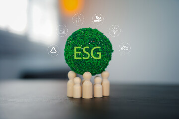 ESG concept of environmental, social and governance. Sustainable corporation development. Hand flips wooden cubes with target setting to ESG icon with other ESG icons on bright background.Copy space. 