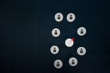 Customer relationship management concept. wooden block with target icon linked with human icons for customer focus group. Data exchanges development and customer service