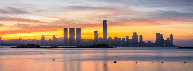 Sunrise over Xiamen's Coastal Cityscape, Fujian Province, China © Dong