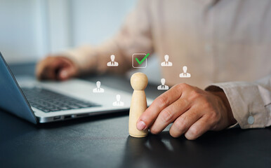 Businessman using magnifying glass to analyze resumes and select qualified candidates on a virtual interface, representing modern recruitment, HR analytics, and digital hiring process.
