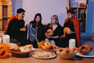 Friends enjoying a Halloween party at a bar making a toast