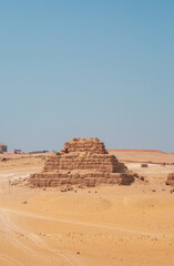 The Giza Pyramids in Cairo, Egypt, panoramic view. General view of the pyramids from the Giza plateau. Three pyramids, known as the Queen's Pyramids, are on the front.