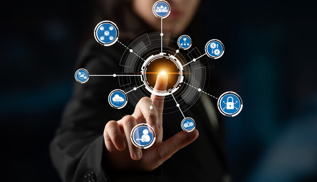 A business professional engages with a digital interface showcasing various technology icons, symbolizing modern connectivity and innovation in today workplace. Crux - Powered by Adobe