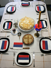 Signs of Serbian orthodox religious glory: candle, grain, Slavic cake, wine, icon of St. Nicholas