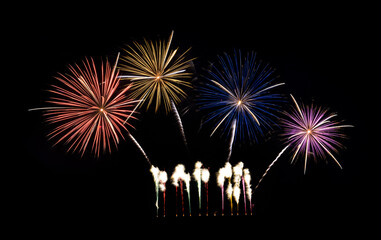 Festive colorful fireworks display isolated on black background for celebration and anniversary