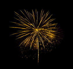 Golden firework sparkling on black background for celebration and anniversary