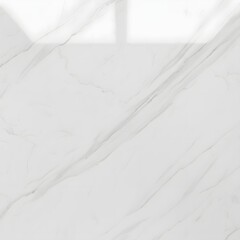 White marble surface with grey veining seen in bright light during the day in a well-lit room