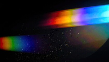 Abstract colorful light streaks against a dark background, dusty