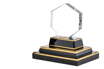 Gold trophy cup placed on a stack of books isolated on a white background symbolizing education and achievement