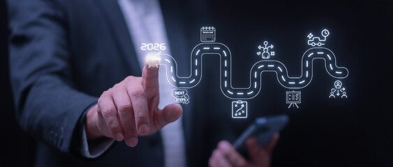Confident businessman pointing business roadmap strategy to success in 2026 on virtual screen interface