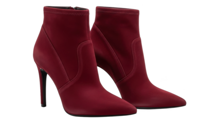 Pair of red pointed toe stiletto ankle boots with black heels on a black background stiletto heels red boots