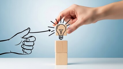 Hand placing a lightbulb drawing on wooden blocks symbolizing idea generation, innovation, and teamwork against a light blue background