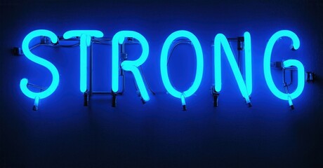 Bright blue neon sign spells STRONG against dark wall. Simple typography, bold illumination, modern aesthetic. Inspiring message.