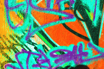 Abstract graffiti with bright orange, turquoise, purple spray paint on textured wall. Urban 90s, Y2K style, fluorescent glow, acid colors. Posters, flyers, creative banner, digital art, summer visuals