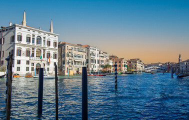 The Grand Canal in Venice at sunset. It is crossed by four bridges: the Rialto Bridge is one of these.