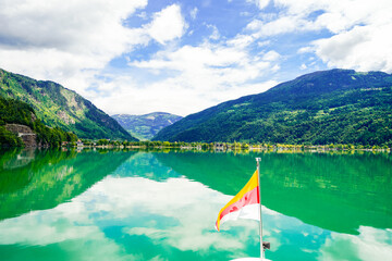 View of Lake Millstatt and the surrounding green landscape. Idyllic nature by the lake north of the Drava Valley near the town of Spittal an der Drau in Carinthia.
